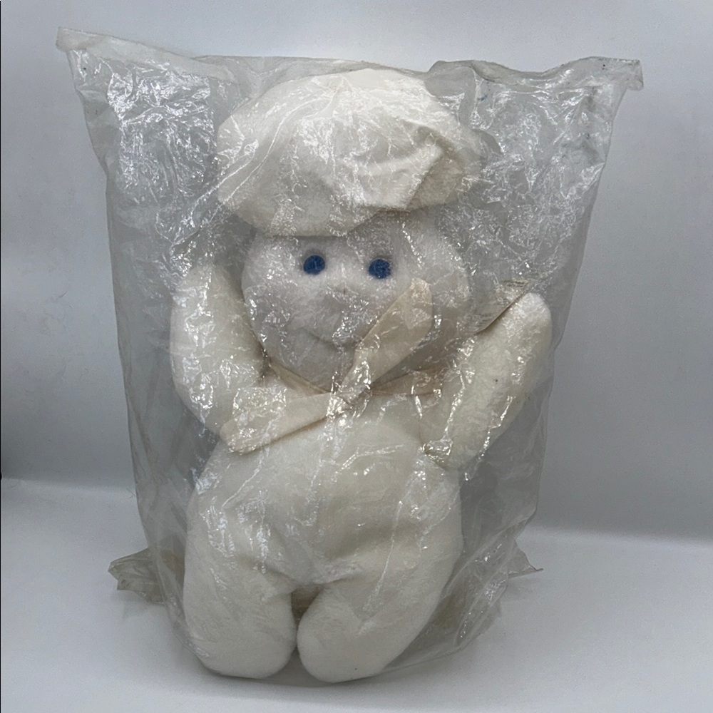 Plush White Stuffed Animal with Blue Eyes